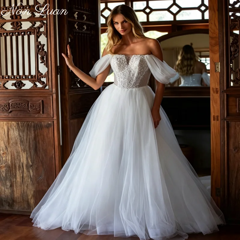 Фото Свадебное платье 2026 Styles Princess из блестящего тюля с открытыми плечами, жемчужным и стразовым лифом, шлейфом-чапел, Vestidos de Novia, на заказ №1
