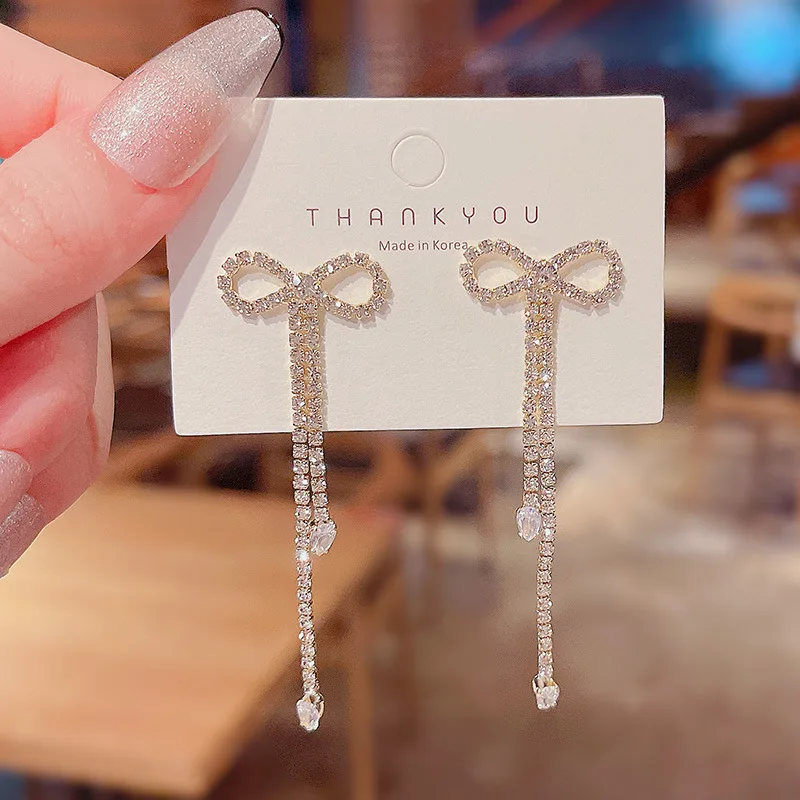 

S925 Silvers Post Bead Zircona Bow Long Tassel Earrings Female Ins Tide Niche Advanced Design Earrings.