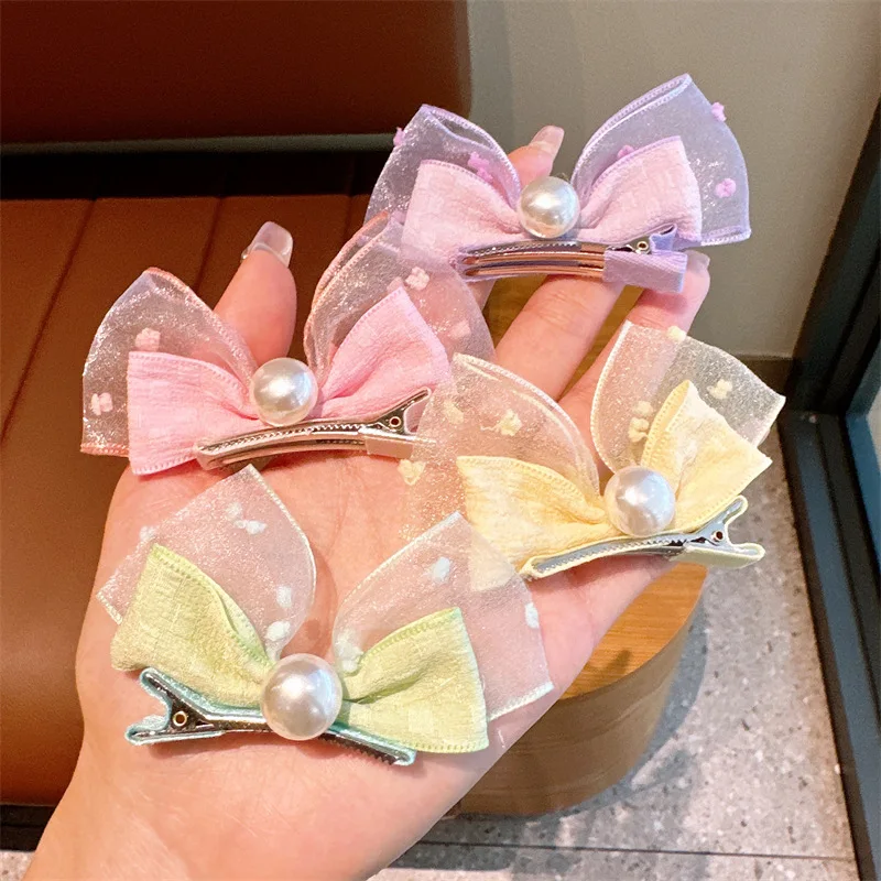 

Wholesale 50pcs Korean Style Pearl Three-Dimensional Bow Rabbit Ears Baby's Pair Clip Children's Hairpin Cute Headwear