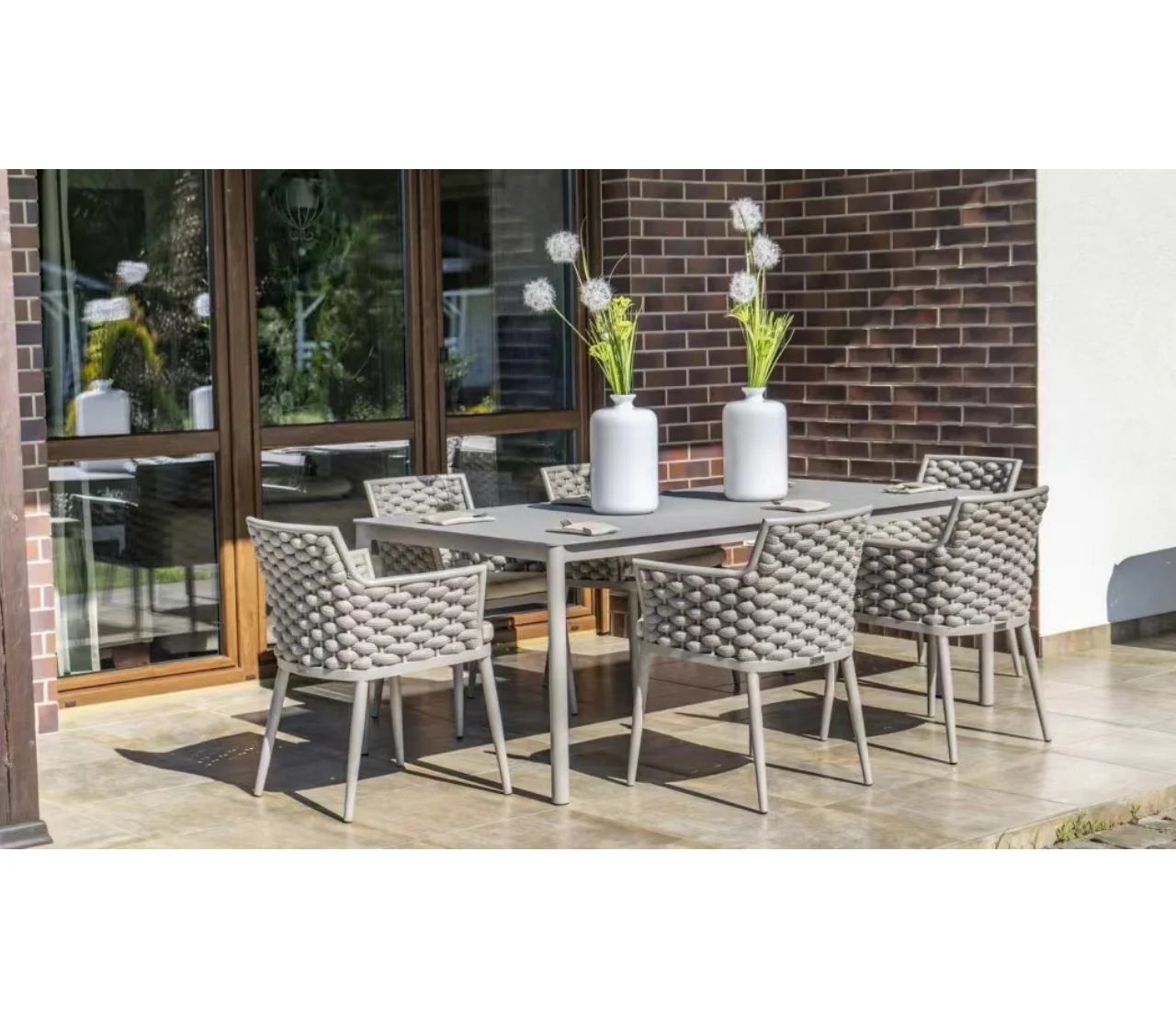 

Leisure style metal frame Olefin rope furniture outdoor dining table and chairs