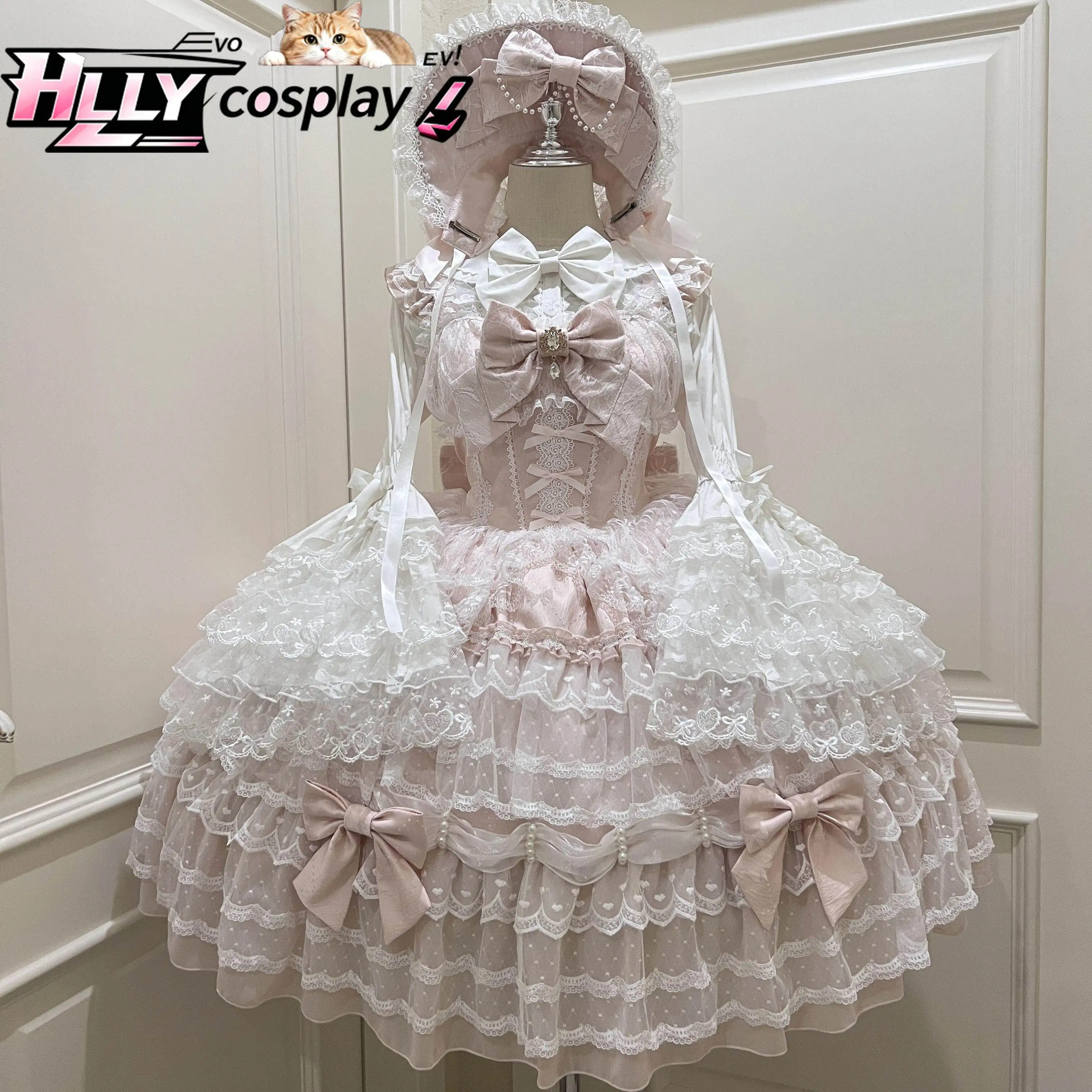 Фото Оригинальное платье JSK в стиле Sweet Lolita, розово-белое, с многоярусными оборками, кружевом и бантом, в кукольном стиле, винтажное, зимнее/осеннее, на бретельках №1