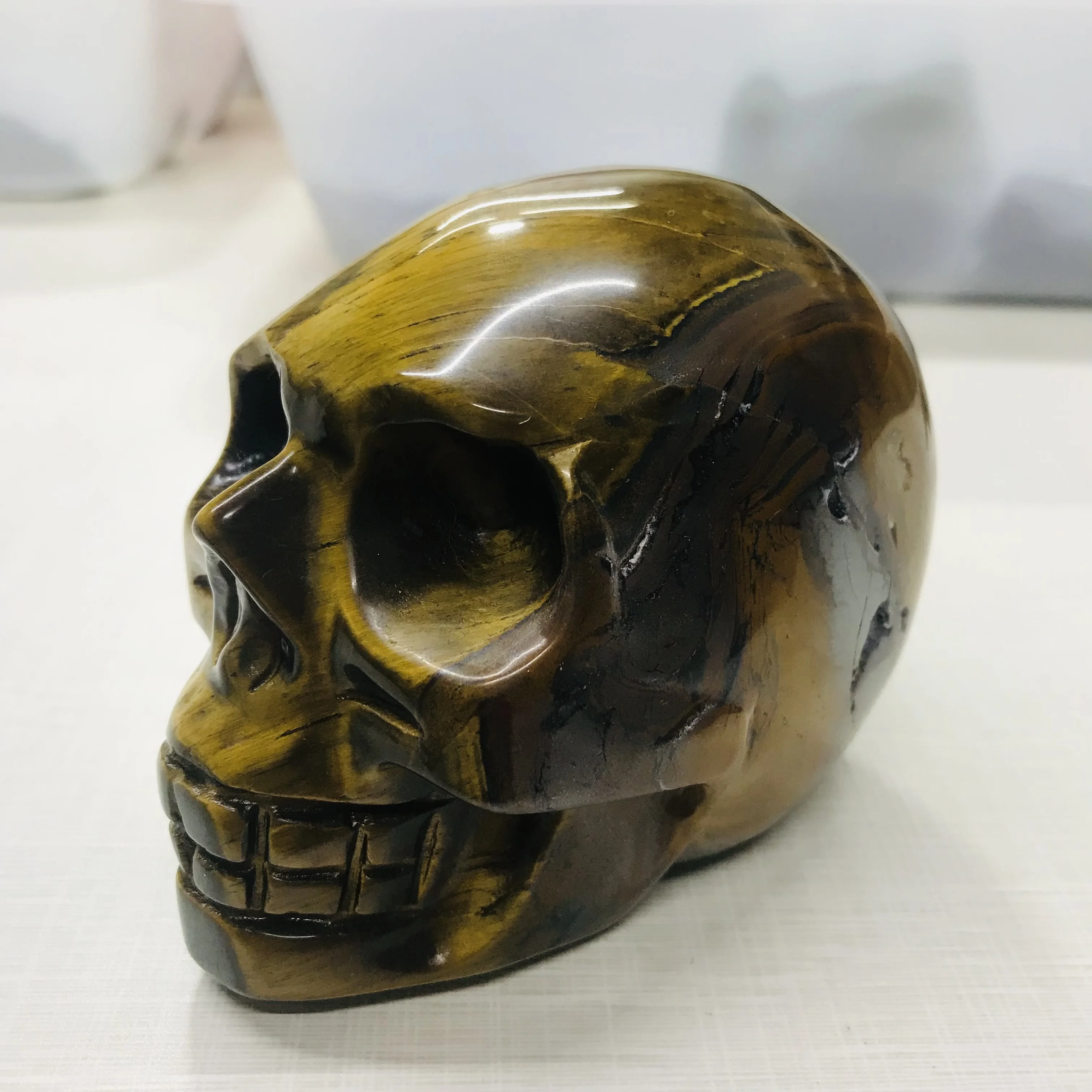 

NATURAL TIGER EYE STONE SKULL FURNISHING ARTICLES RAW ORE SPECIMENS ALLEVIATE FATIGUE STONE