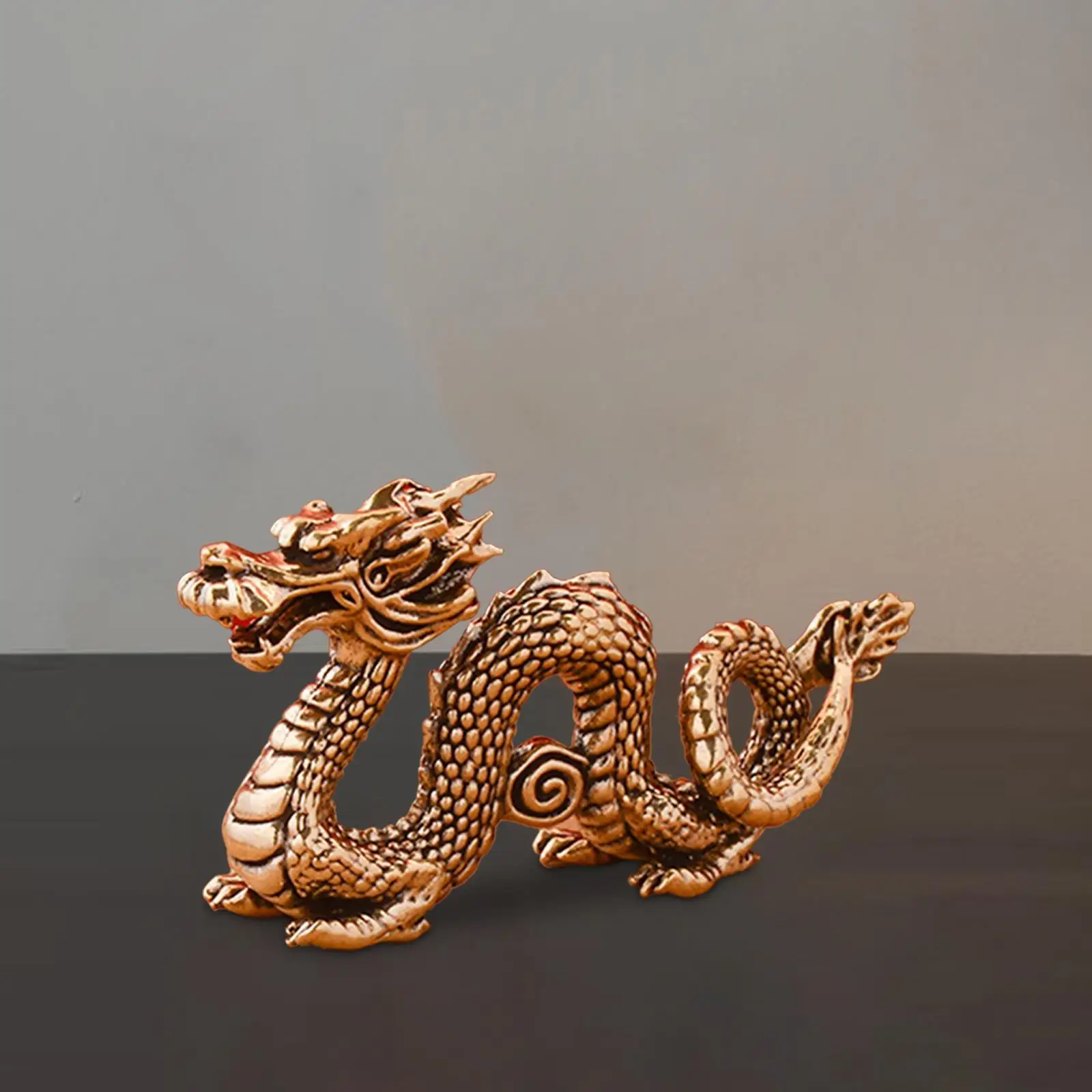 

Латунная статуэтка дракона