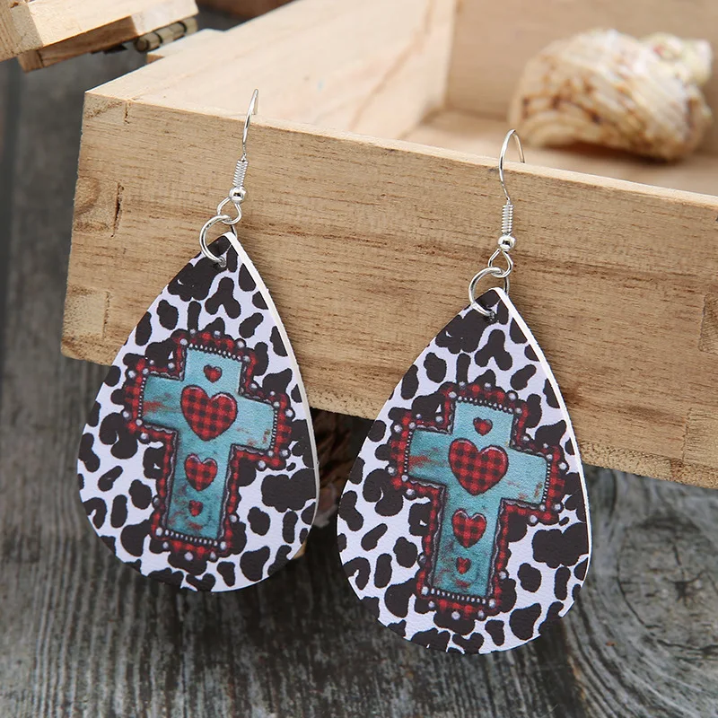 

2021 European and American Valentine's Day Retro Water Drop Cow Pattern Cross Love Leather Earrings for Women Wholesale