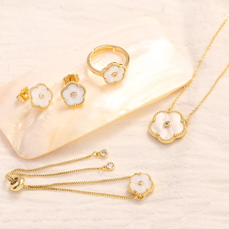 

CARLIDANA 4pcs/Set Luxury Clover Pendant Necklace/Earrings/Ring/Bracelet Gold Color Stainless Steel Clover Jewelry Set for Women