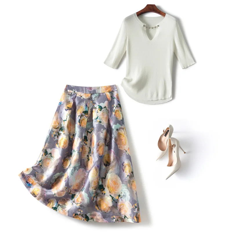 

Korean 2022 summer new women's short sleeve pure color knit top temperament printed skirt set