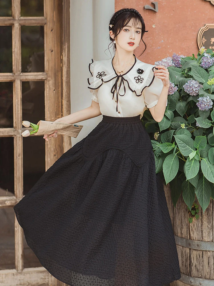 

New women's retro Heavy industry flower doll collar beige shirt with black half skirt age-reducing long dress suit