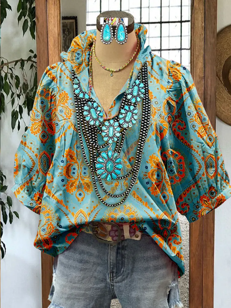 Женская блузка с цветочным принтом и пышными рукавами