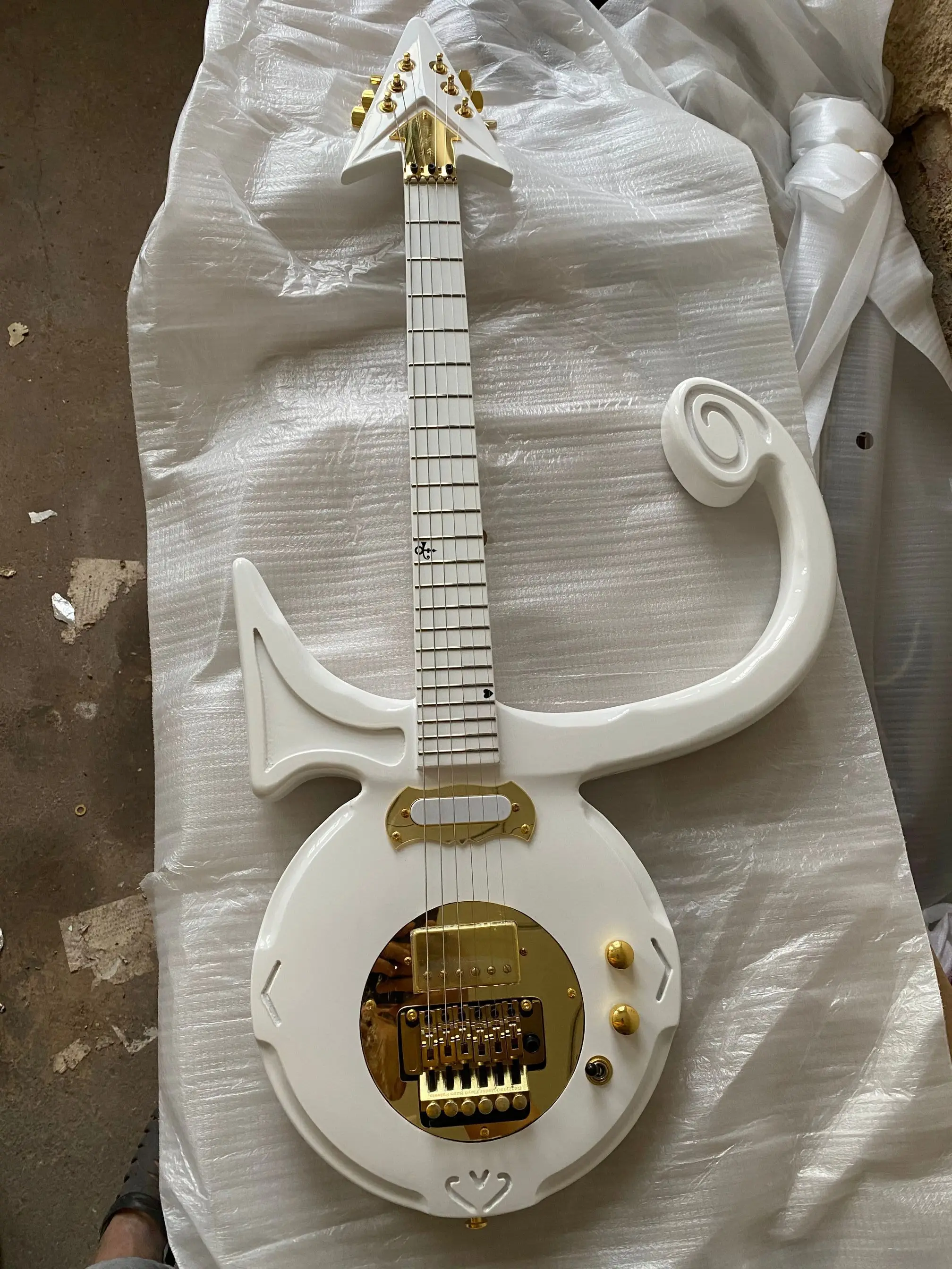 

Hand Made Model C Prince Symbol electric guitar