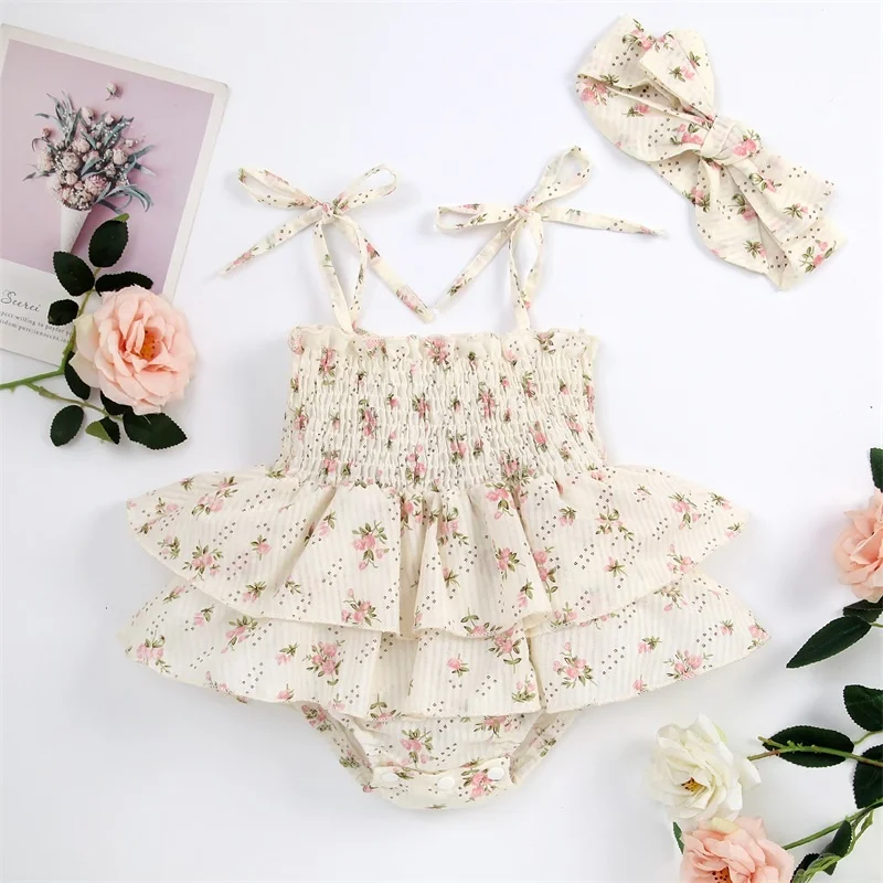 

Princess Floral Baby Girls Summer Jumpsuit Elasticated Bust Sleeveless Ruffled Lace Up Romper with Bow Headband for Toddler