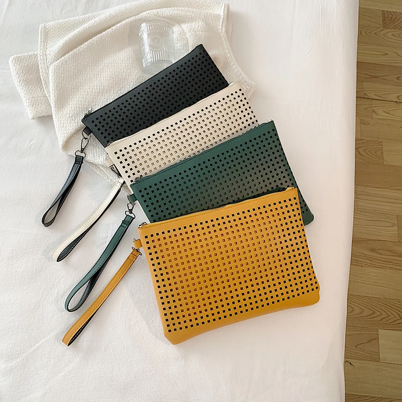 Hand bag simple temperament hollow-out bag female senior texture hand bag fashion envelope bag tide