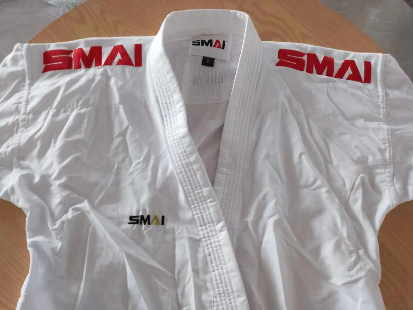Фото Официальное обозначение карате GI SMAI Kumite WKF утвержден kumite Master K1 Премьер-лига каратэ GI Униформа используется для соревнований №1