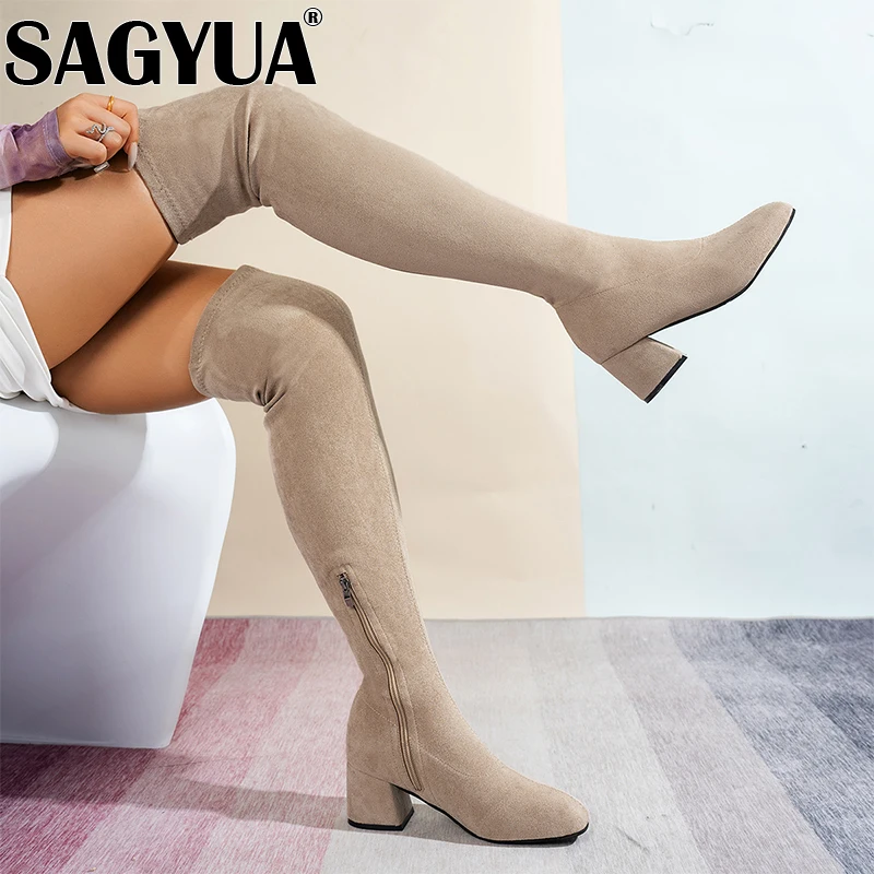 Женские сапоги выше колена на высоком каблуке. Замшевые туфли массивном