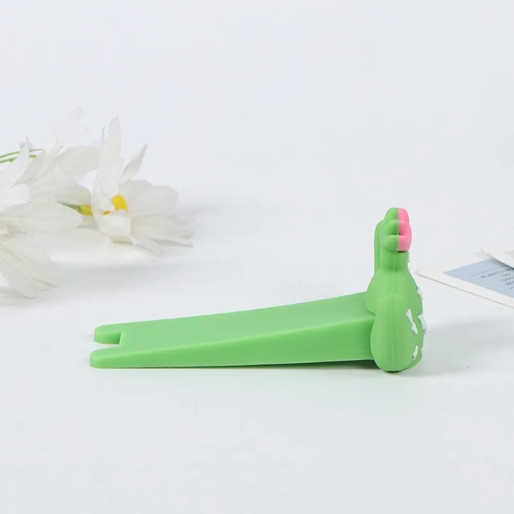 

Силиконовый дверной стопор мультяшный