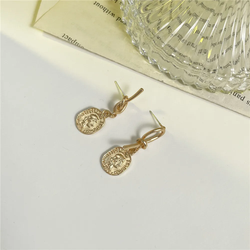

Korean Version Gold Coin Portrait Bow Asymmetrical Female High-end Temperament Personality Simple Earrings