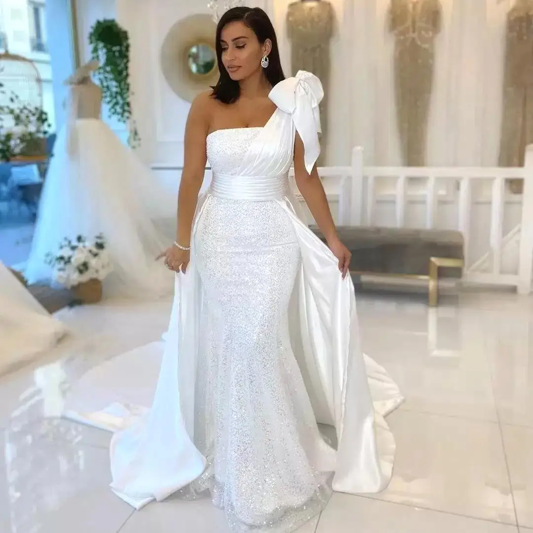 

2022 Shiny White Mermaid Wedding Dresses One Shoulder with Bow Satin and Sequined Bridal Gowns Ribbons Bridal Vestidos De Novia
