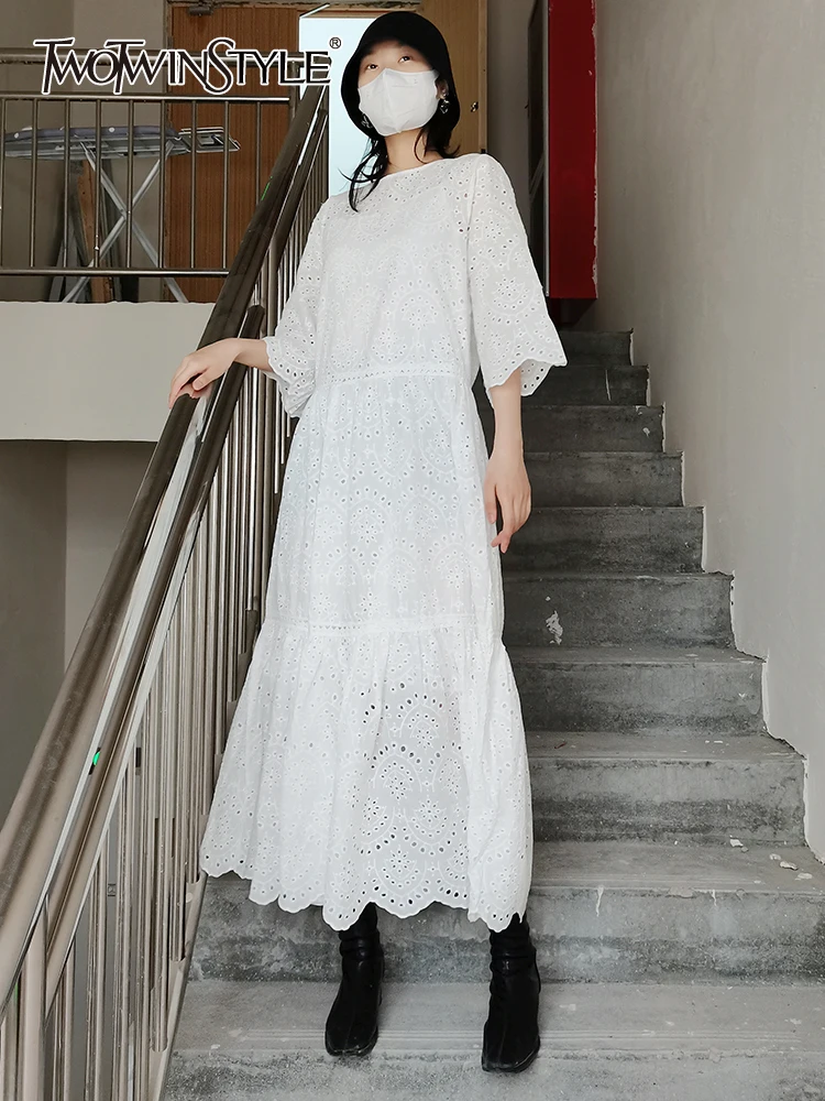 

TWOTWINSTYLE Cut Out White Dress For Women Round Neck Half Sleeve Solid Minimalist Midi Dresses Female Spring Clothing Style New