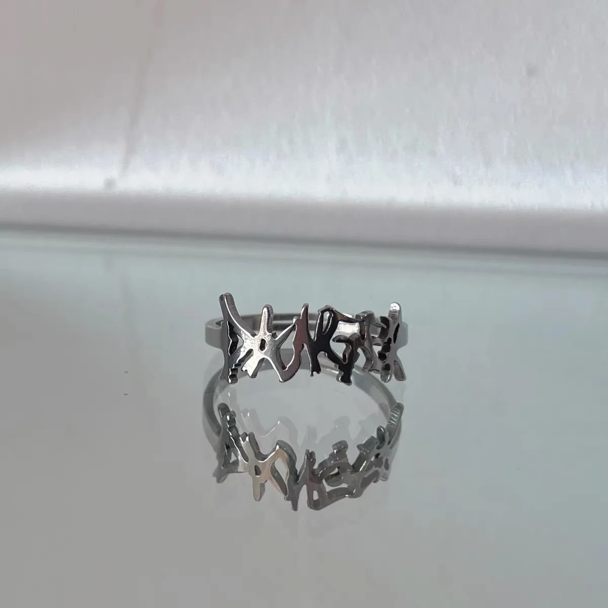 

In copper ring letter titanium steel thorn simple punk ring dark stainless steel