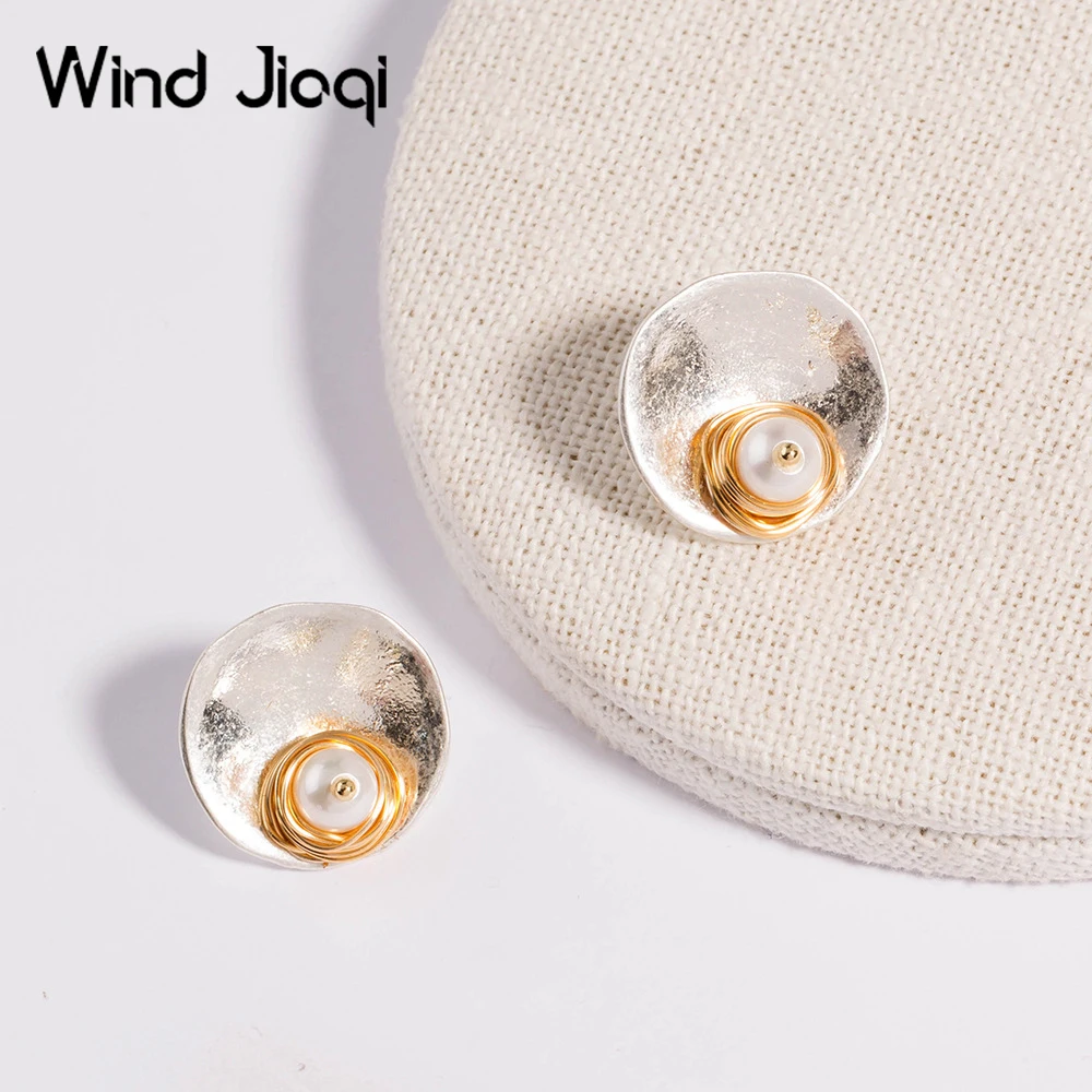 

Круглые серьги-гвоздики с имитацией жемчуга