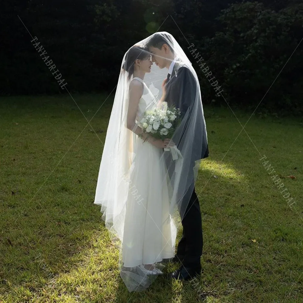 Простое свадебное платье без рукавов с круглым вырезом длиной до щиколотки