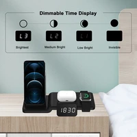 four in one wireless fast charging vertical stand with clock function for apple headset mobile phone watch