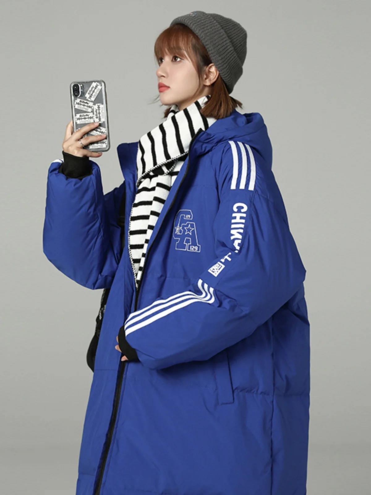 Зимний большой стеганый пуховик женский средней длины выше колена утолщенный