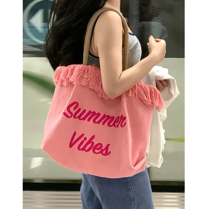 

2023 Summer New Large Capacity Canvas Tote Bag Women's Tassel Handheld Shopping Bag Student Commuter Fashion Casual Shoulder Bag
