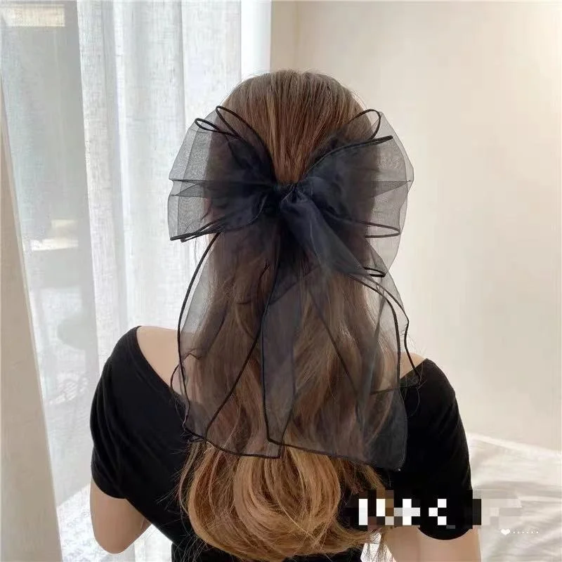 

Korean version of retro style ~ temperament fairy net red with the same organza black sexy big bow hairpin top clip