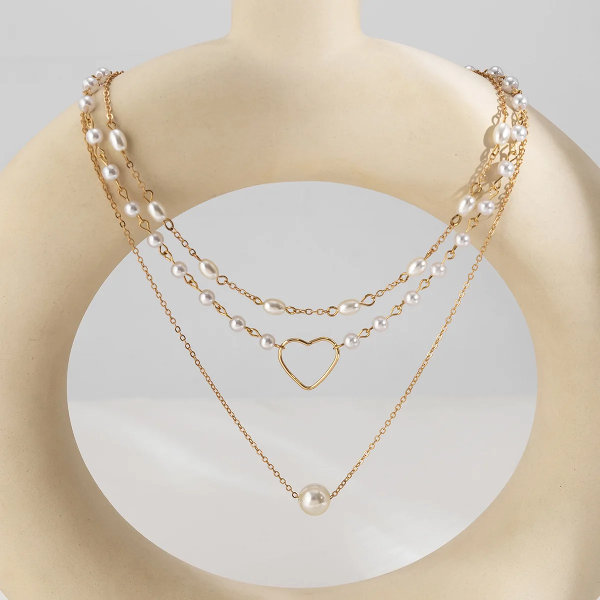Accessories: Versatile geometric bead chain, stacked necklace, niche imitation pearl openwork love necklace