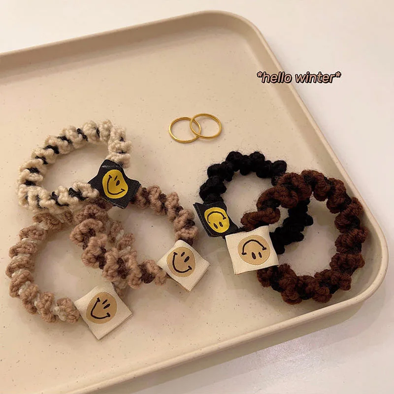 

Эластичная плетеная повязка для волос с улыбающимся лицом