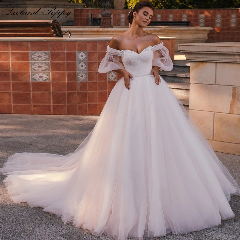 

Lceland Poppy Women's A Line Boat Neck Beaded Tulle Wedding Dresses Floor Length Pleated Bridal Gowns with Belt