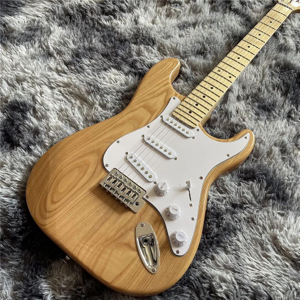 

New Arrival custom electric guitar in Natural wood color with maple fingerboard , chrome hardware , white pickguard