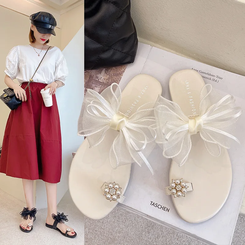 

Тапки женские летние низкие Роскошные сланцы женская обувь со шнурком-бабочкой блестящие 2023 плоская резиновая обувь с узлом-бабочкой