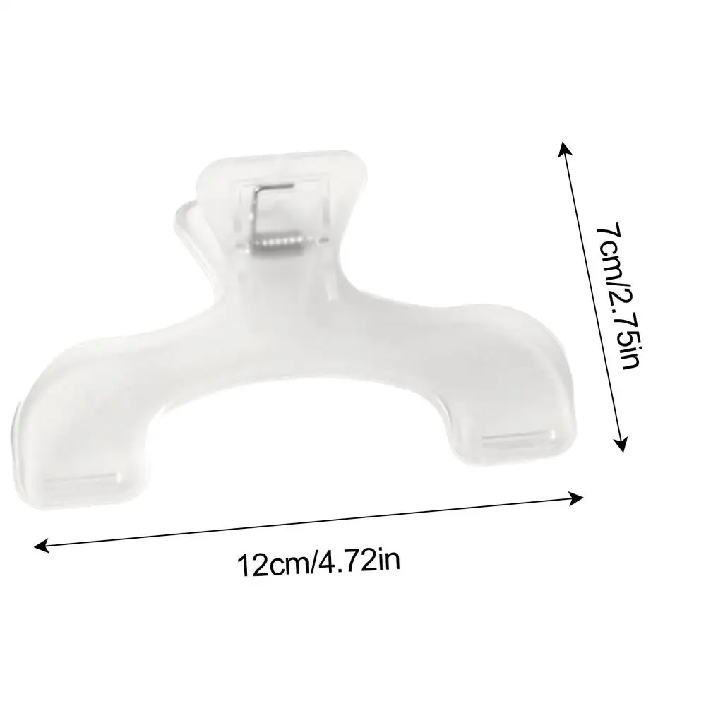 

Прозрачный пластиковый зажим для книг