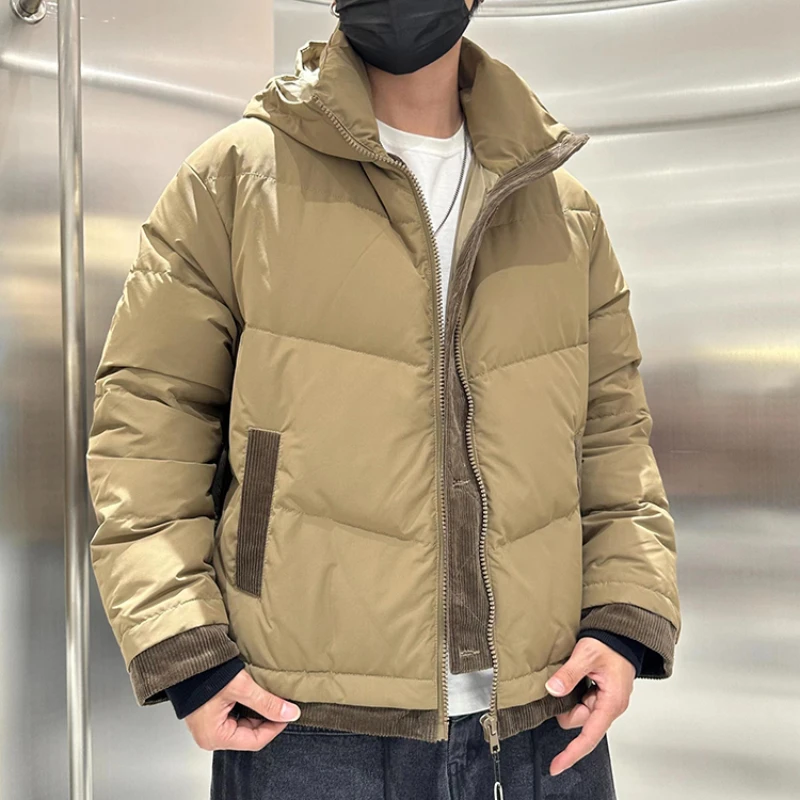 Hooded down jacket men's fake two pieces of loose shoulder sleeves in winter, the new warm outer wear black stitching jacket.
