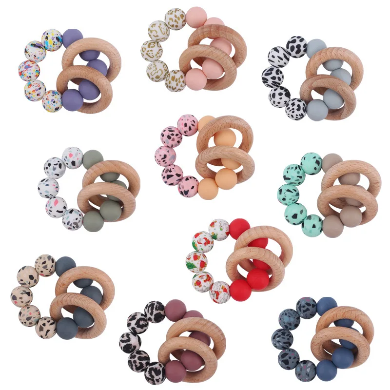 

Food Grade Infant Baby Teether Leopard Silicone Beads Chewing Bracelet Beech Wood Rattles Teething Toys Baby Shower Nursing Gift