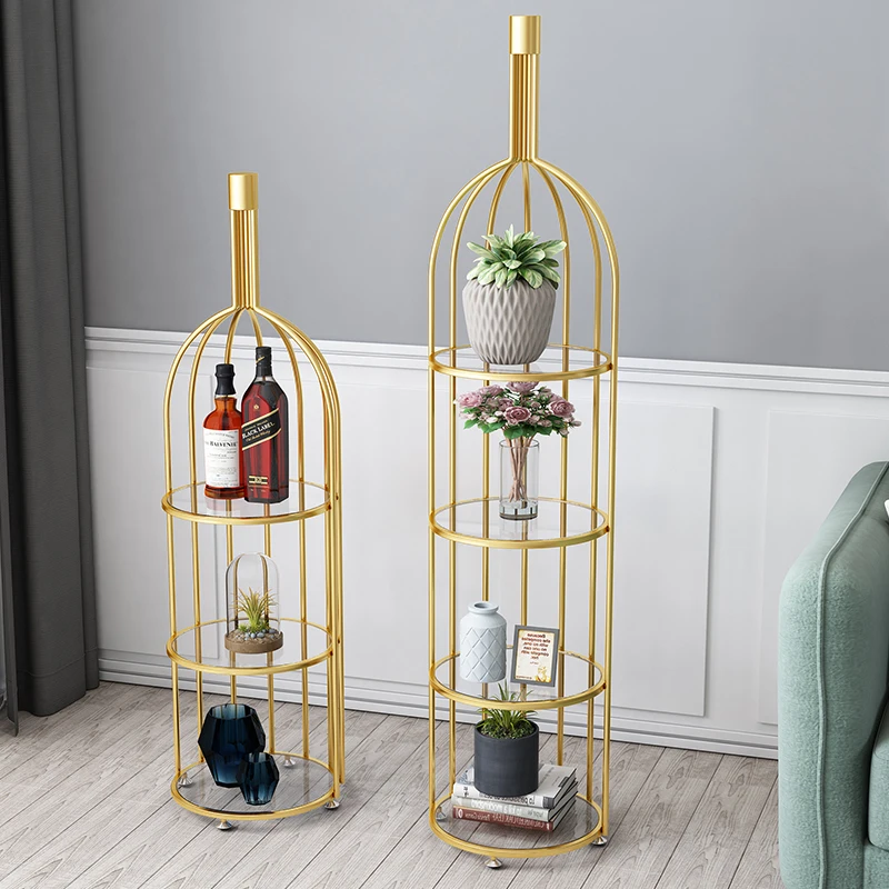 

The Living Room Is Decorated With Golden Metal Flower Shelf Birdcage Wine Rack