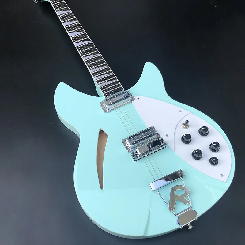 

High-quality 6-string 360 guitar, basswood body, light blue bright paint, two outputs, mahogany fingerboard free shipping.
