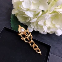 brand top luxury brand letter c spiral cross gold brooch inlaid with steel glittering pearl full of gold