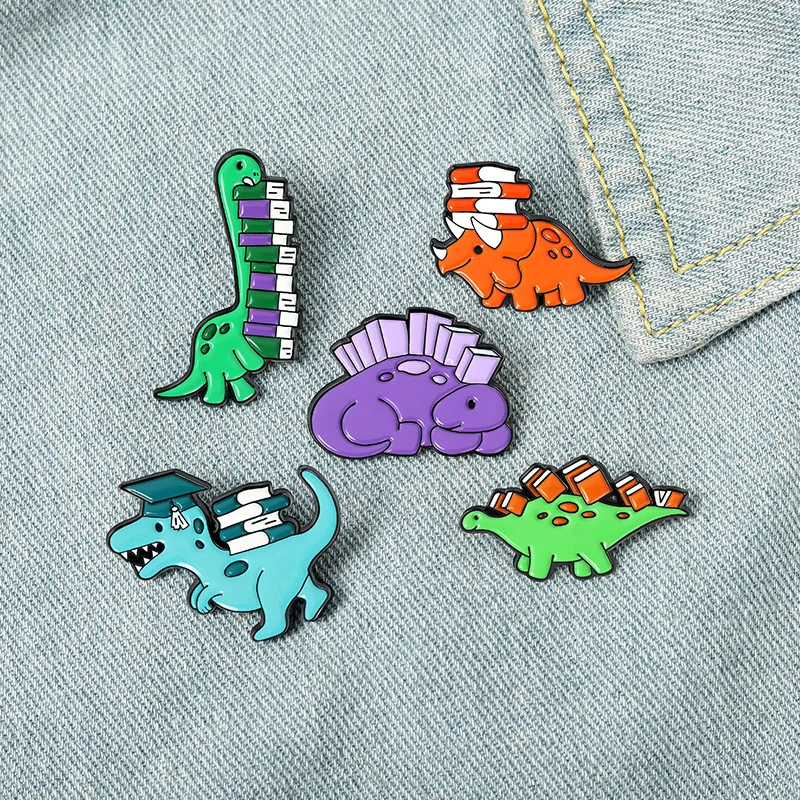 Wisdom Dinosaur Enamel Pins Custom Book Stegosaurus Triceratops Brooches Shirt Lapel Badge Bag Animal Jewelry Gift for Kids