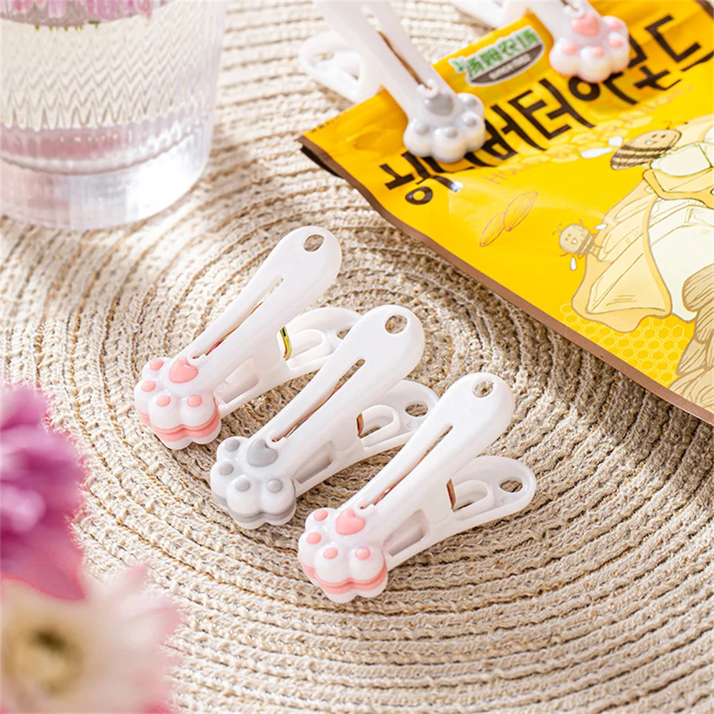 

12pcs Cute Cat Paw Plastic Clips Laundry Hanging Clothes Pins Household Clothespegs Beach Towel Clips Clamp Snacks Sealing Clips
