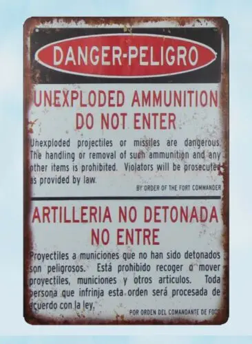 Неразорвавшиеся боеприпасы Peligro не входят в металлический жестяной знак