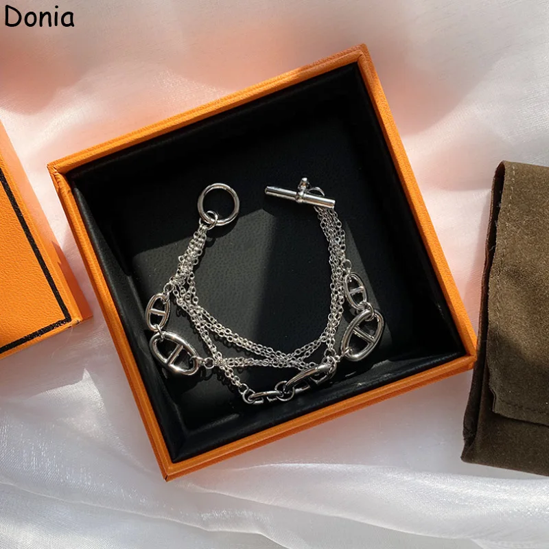 

Donia Jewelry New European and American Fashion Pig Nose Smooth Titanium OT Buckle Palace Luxury Retro Bracelet.