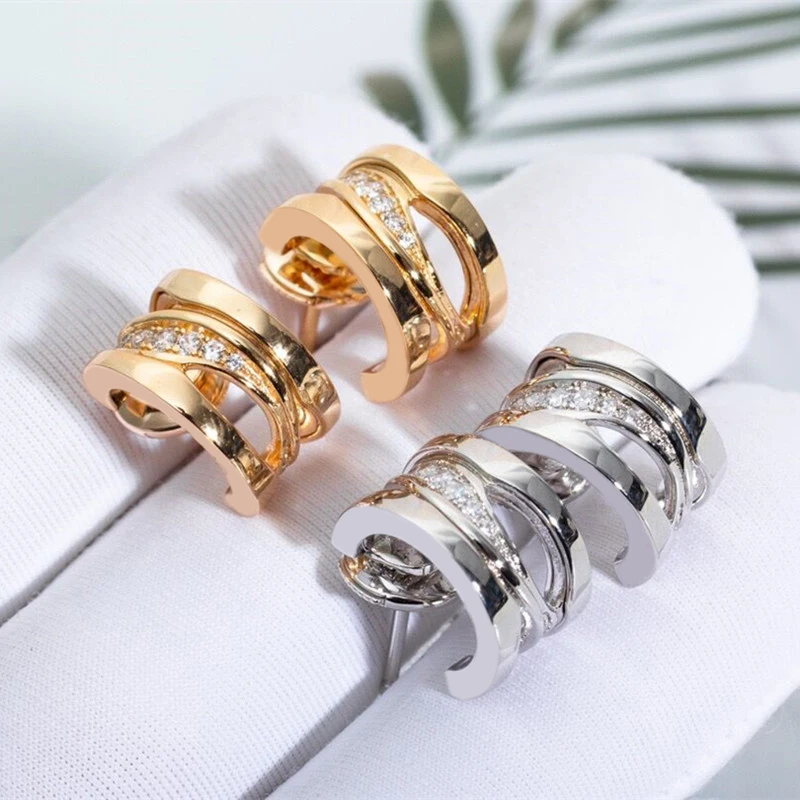 

Hot selling brand 925 sterling silver zircon hollow twisted earrings for women's fashion high-end design luxury jewelry