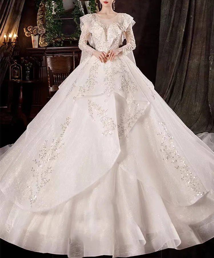 

Роскошное светильник свадебное платье цвета шампанского с длинным рукавом, круглым вырезом, оборками, сверкающими бусинами, блестками и рю...