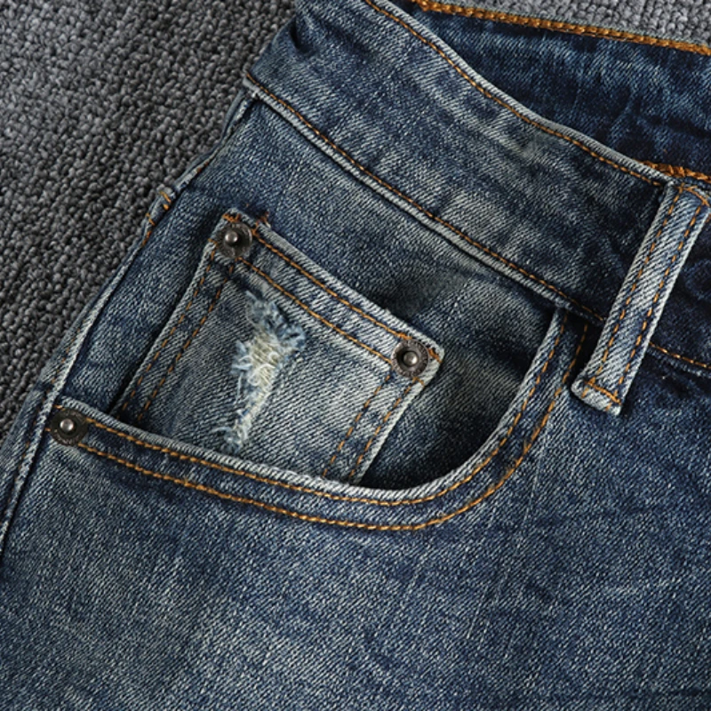 High street retro ins trend to make old ripped patch jeans men's slim feet baggy autumn trousers