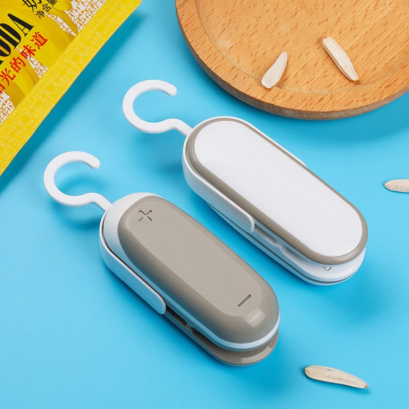 

Mini Capper Portable Heat Sealer Snacks Plastic Bag Open Tools Household Food Preservation Hand Press Small Sealing Machine