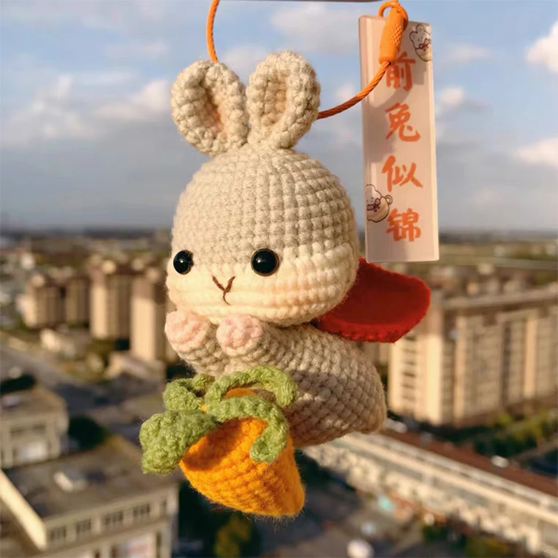 

Handmade yarn weaving auspicious meaning of the future is like a broken, hiking Qingyun rabbit key chain car hanging woven mater