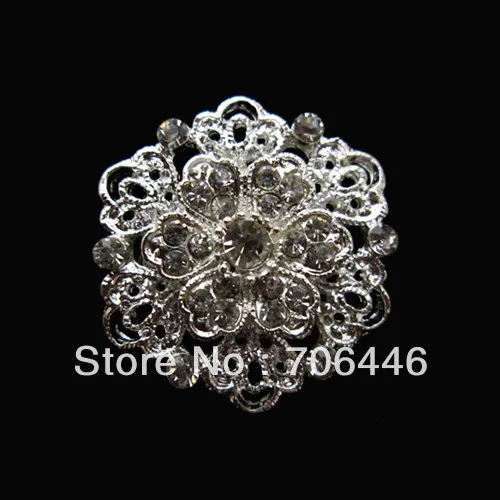 

Брошь в виде цветка с кристаллами и прозрачными стразами