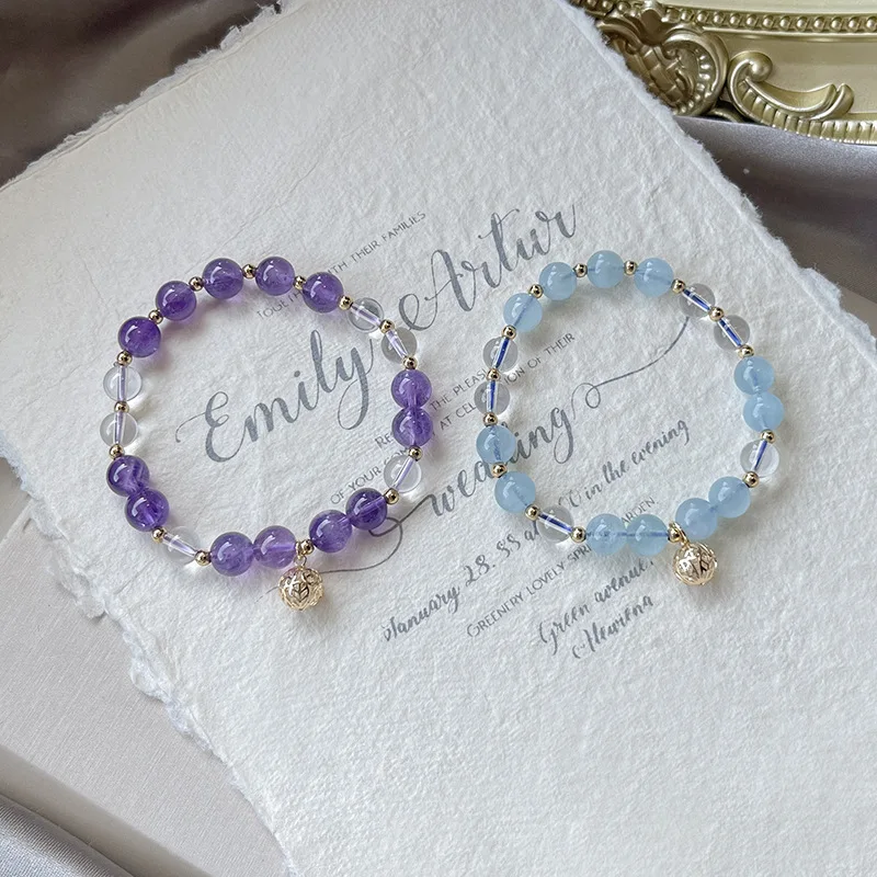 

Женский браслет из бисера с натуральным аквамарином и фиолетовыми кристаллами